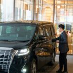 Noir Miami Limo chauffeur loading luggage curbside for a cruise transfer